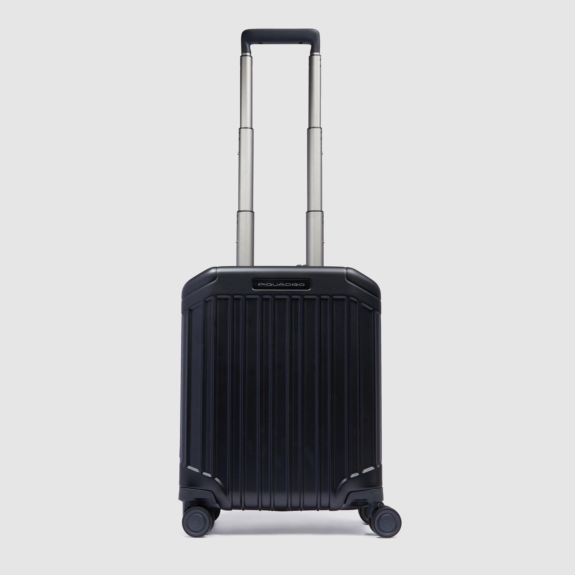 Piquadro underseater carry-on trolley in lightweight polycarbonate, featuring a TSA lock, removable washable lining, and integrated address tag for seamless travel