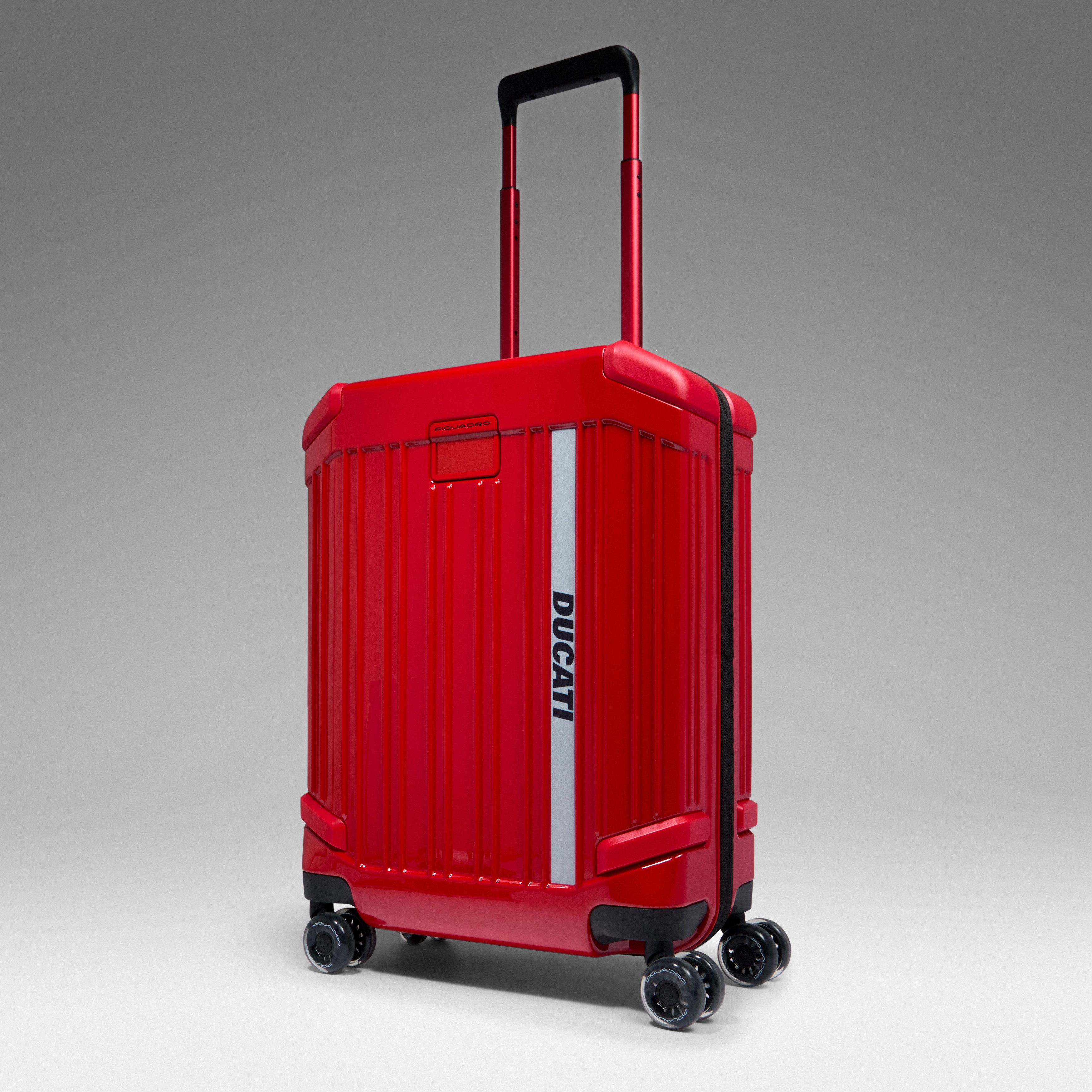 Red Ducati-branded hard-shell suitcase with a telescopic handle and four spinner wheels, shown against a neutral grey background.